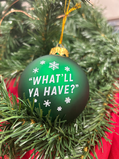 Green Varsity Christmas ornament ball with snow flakes and the phrase "What'll Ya Have?"